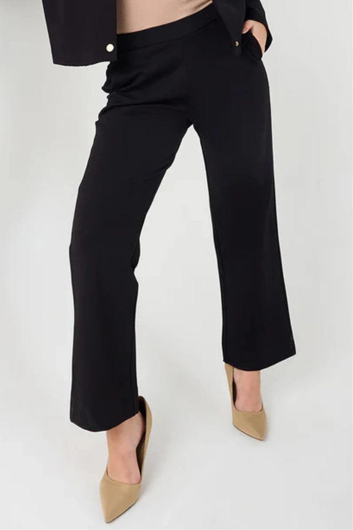 Black women’s straight-leg formal trousers with elastic waist.