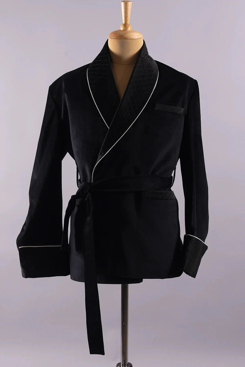 Close-up of quilted cuff design on men’s black velvet smoking jacket
