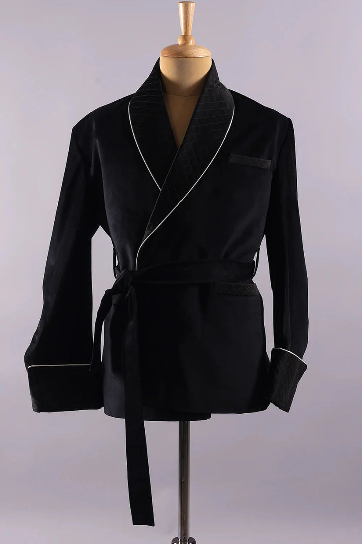 Close-up of quilted cuff design on men’s black velvet smoking jacket
