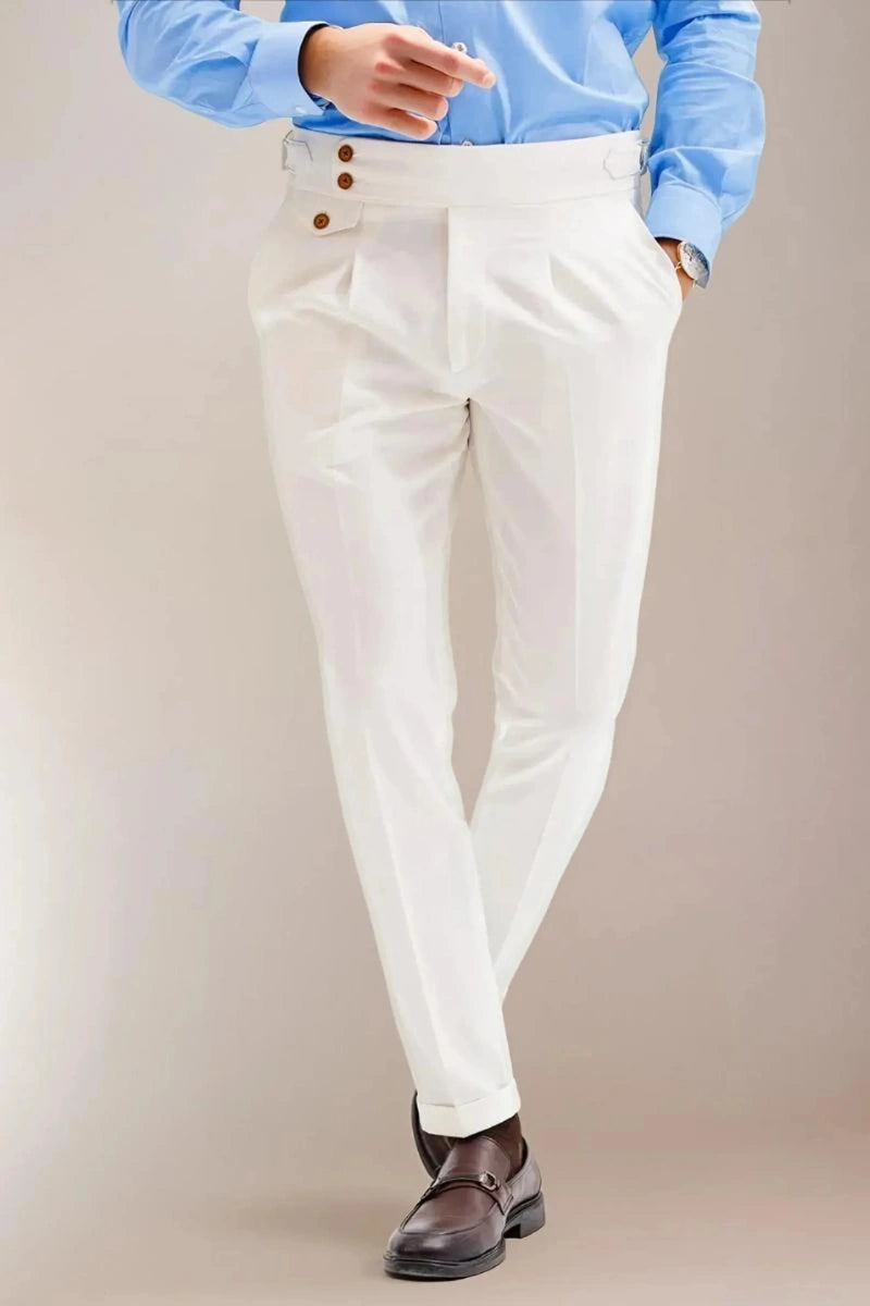 White designer Gurkha pants with classic pleats and side buckles