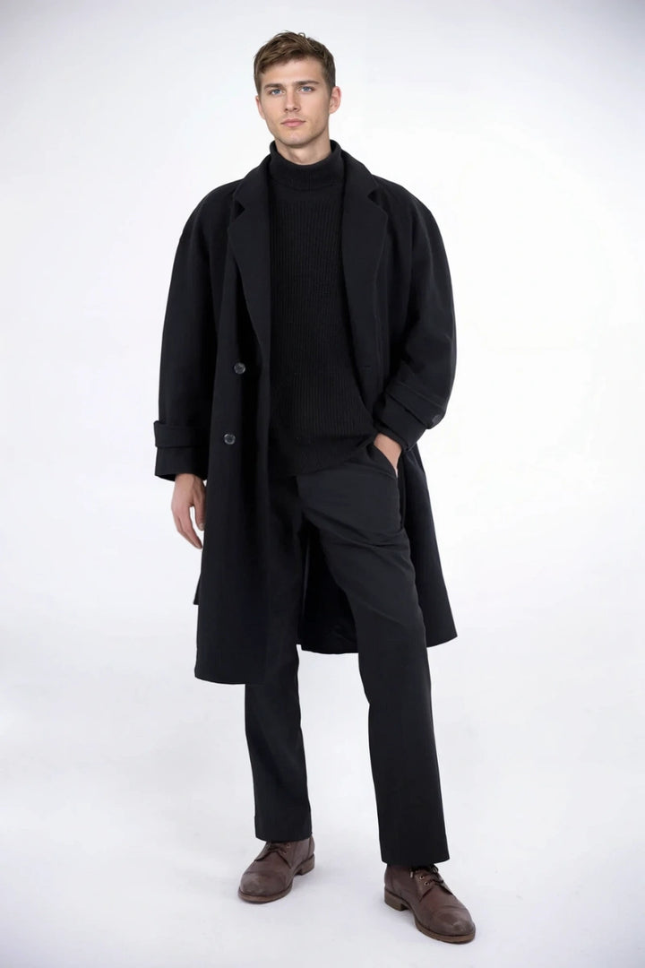 Men wearing a black wool overcoat over a suit, suitable for business meetings or formal events.