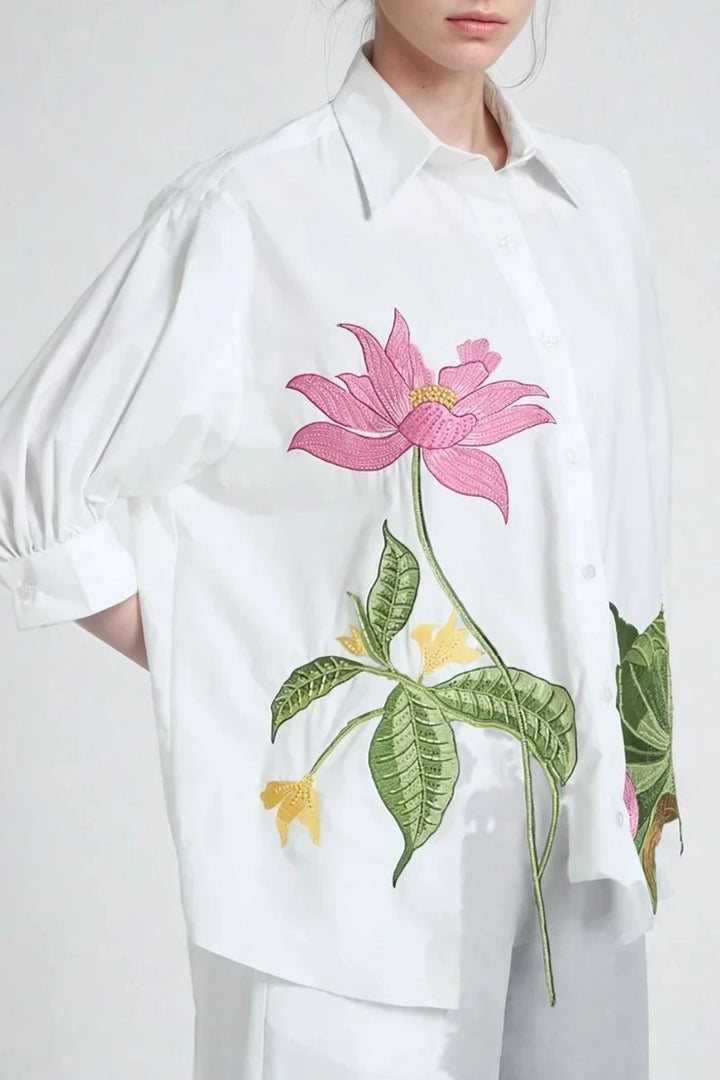 Stylish women’s puff sleeve top with front button closure and matching trousers