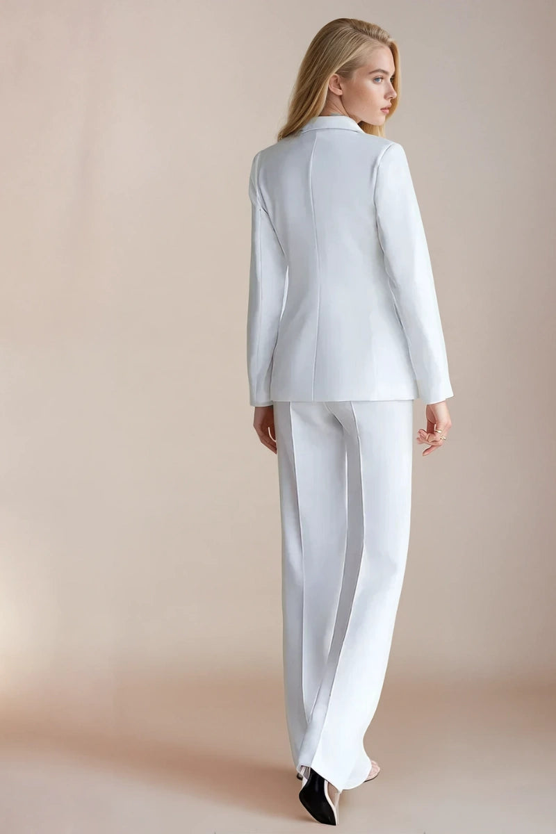 Back view of women’s white three-piece formal suit showing tailored fit