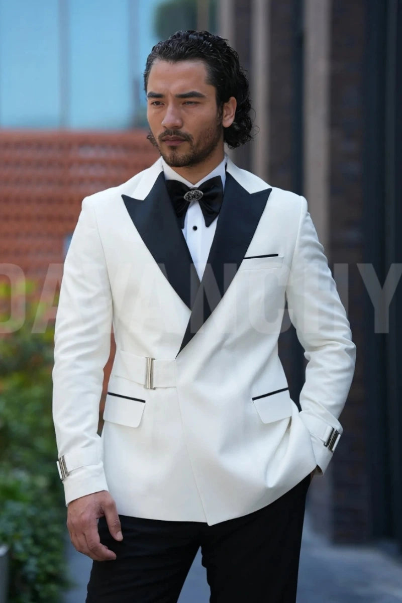 Man wearing white double-breasted tuxedo blazer with black pants and satin peak lapel